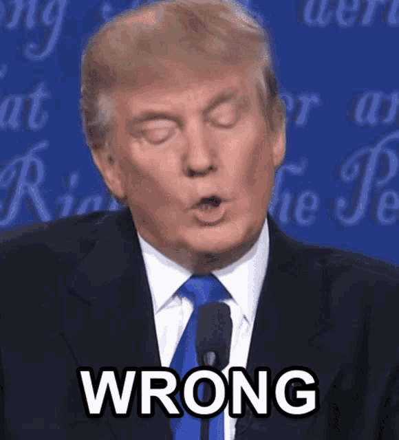 donald trump speaking into a microphone with the word wrong on his face