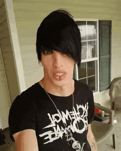 a man wearing a black t-shirt that says low velocity on it