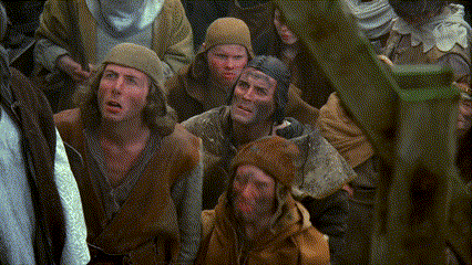 a group of people with their faces covered in mud are looking at something