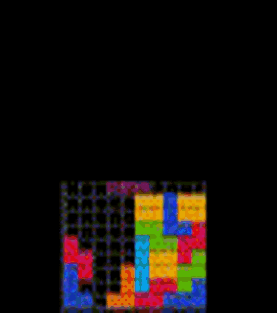 a tetris game with a lot of colorful blocks on a black background .