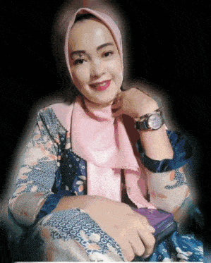 a woman wearing a hijab and a watch looks at the camera with her hand on her chin