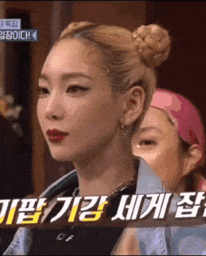 a close up of a woman 's face with korean writing on the bottom right