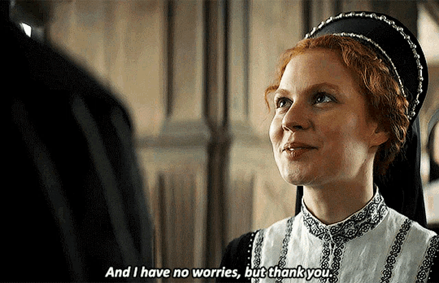 a woman with red hair is talking to a man and says and i have no worries but thank you
