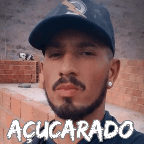 a man with a beard is wearing a hat with the word acucarado on it