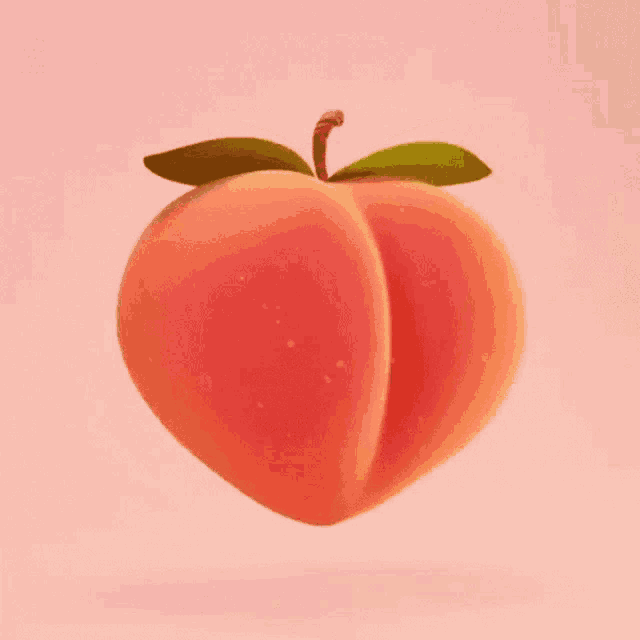 a peach with a green leaf on it is flying through the air .