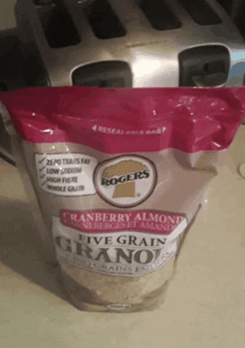 a bag of rogers cranberry almond live grain granola sits on a counter