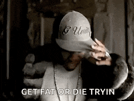a man wearing a hat and a fur coat is saying `` get fat or die trying '' .