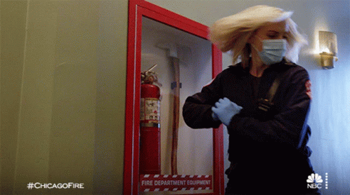 Getting The Fire Extinguisher Sylvie Brett GIF - Getting The Fire Extinguisher Sylvie Brett Chicago Fire GIFs