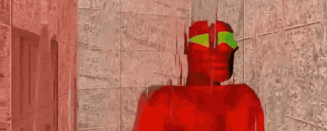 a red superhero with green goggles is standing in a bathroom .