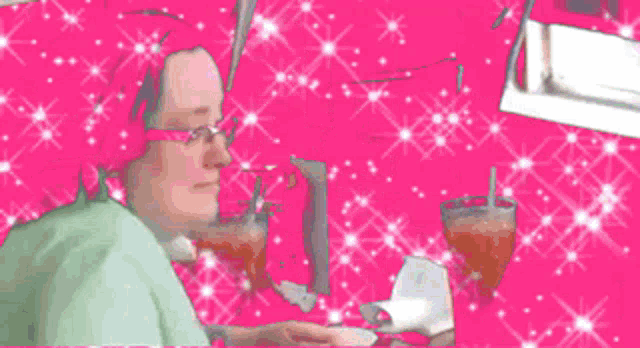 a woman with dreadlocks is sitting on a pink background