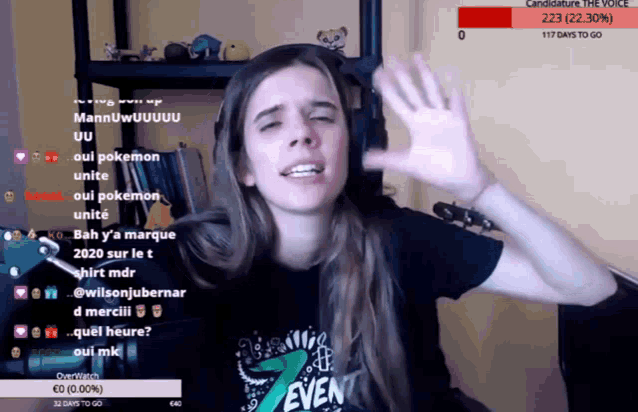 a woman wearing a shirt that says even is waving her hand