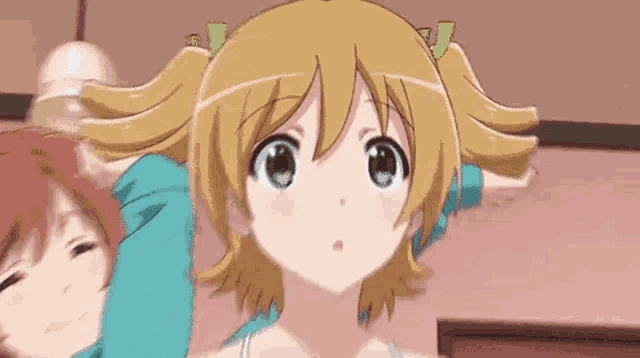 a close up of a cartoon girl with two pigtails standing next to a boy .