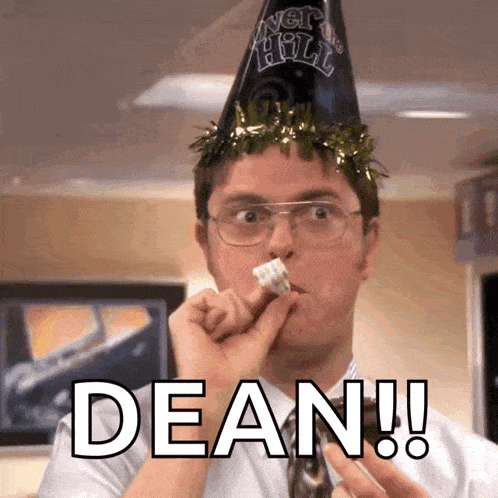 a man wearing a party hat says dean