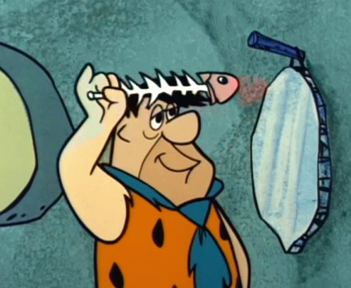Fred Flintstone Fish Skeleton GIF - Fred Flintstone Fish Skeleton Comb GIFs