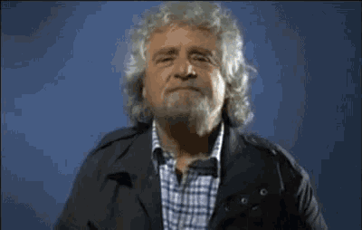 a man with gray hair and a beard is saying e pigliate na pastigla