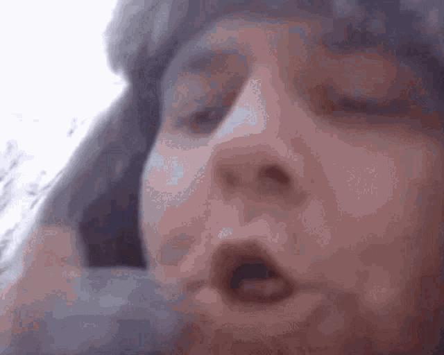 a woman with a surprised look on her face