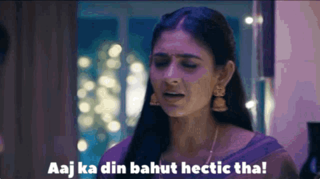 a woman in a purple dress says aaj ka din bahut hctic tha