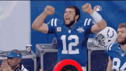 a football player in a blue jersey with the number 12 on it