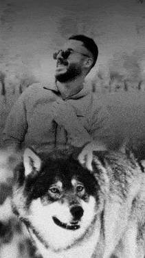 a black and white photo of a man and a wolf with the word liberty in the background