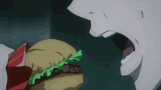 a close up of a person eating a hamburger with lettuce