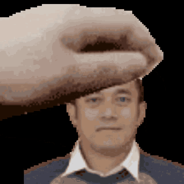 a pixelated image of a man 's face with a hand on his head