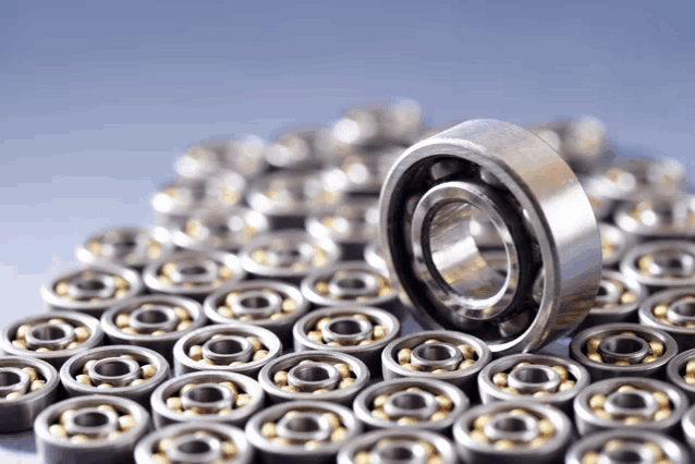a bunch of metal bearings are lined up in rows