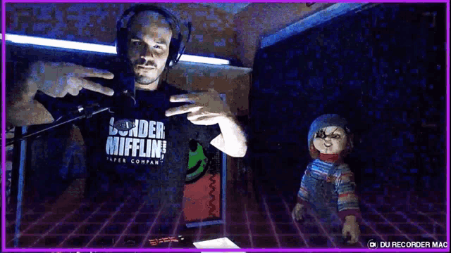 a man wearing headphones and a shirt that says ' slander mifflin ' on it