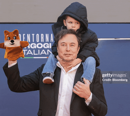 a man carrying a child on his shoulders with a puppet in front of a sign that says " rentorna "