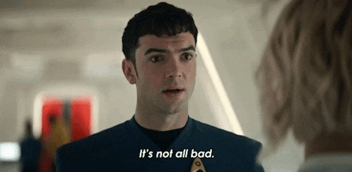 a man in a blue uniform is talking to a woman and saying `` it 's not all bad '' .