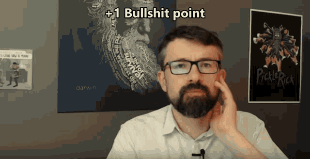 a man with glasses and a beard has +1 bullshit point written on his face