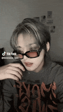 a tiktok of a person wearing sunglasses
