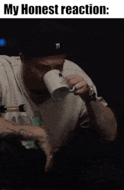 a man drinking from a mug with the words " my honest reaction " above him