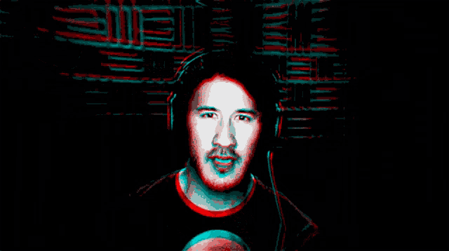 a man in a black shirt is surrounded by red and blue images of faces