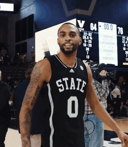 a basketball player wearing a black jersey with the number 0 on it