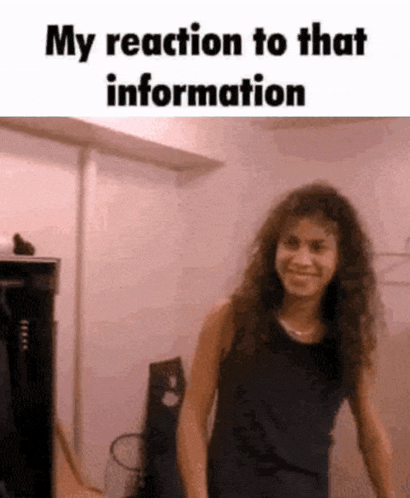 a woman in a black tank top is standing in a room with the words " my reaction to that information " above her