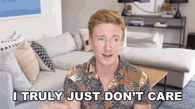a man in a living room says i truly just don t care