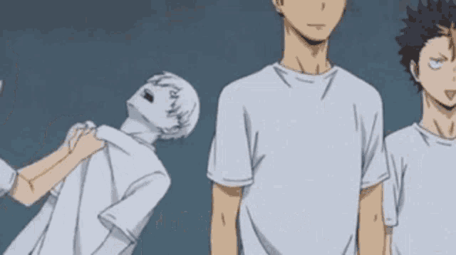 a group of anime characters are standing next to each other in a row .