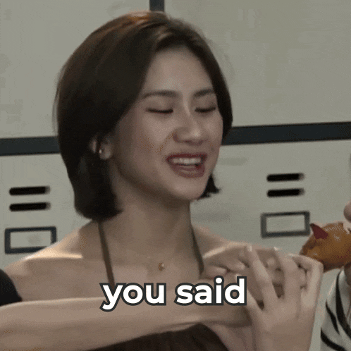 a woman in a bikini says you said while holding a donut