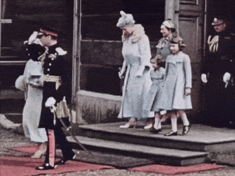 a group of people in military uniforms are walking down a set of stairs
