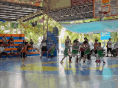 a blurred image of a basketball game with a sign that says ' a ' on it