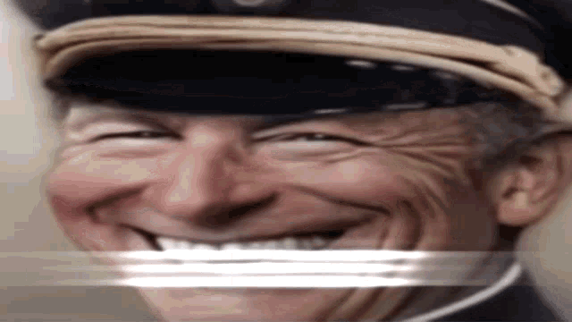 a man wearing a military hat is smiling with a white line between his mouth and eyes