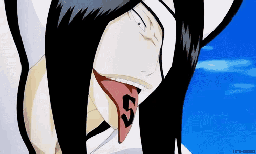 a close up of a person 's face with their tongue sticking out and the words srta-kuchi on the bottom right
