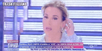 a woman is on a television screen with the words trash italiano on the bottom