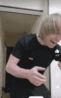 a man wearing a black t-shirt that says 0908