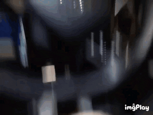 a close up of a person 's hand on a steering wheel with imgplay written below it