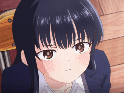 a close up of a girl 's face with a slight smirk on her face