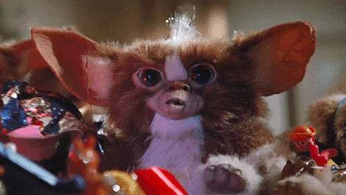 a close up of a stuffed animal that looks like a gizmo from gremlins