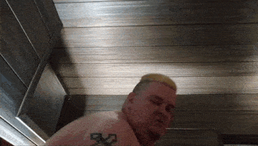 a man with a tattoo on his arm that says ' x ' on it