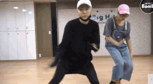 a man and a woman are dancing in a dance studio .