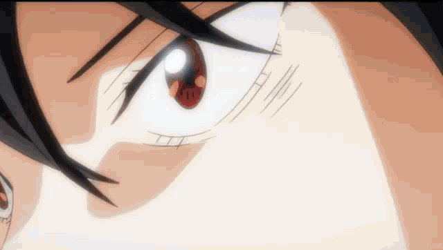 a close up of a person 's eye with a red eye